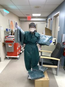 happy healthcare worker with gown delivery