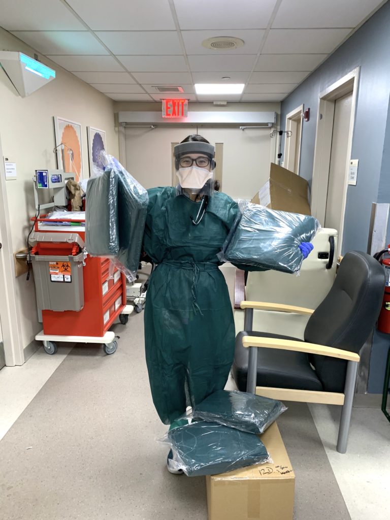 happy healthcare worker with gown delivery