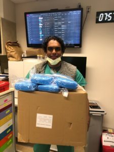 happy healthcare worker with gown delivery
