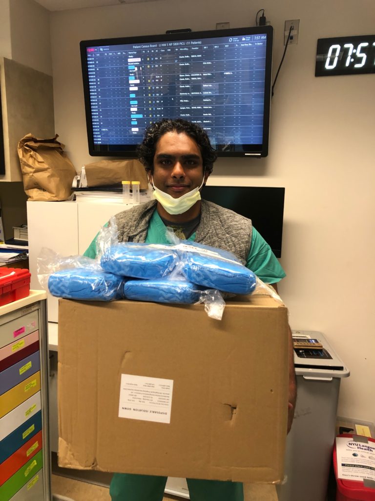 happy healthcare worker with gown delivery
