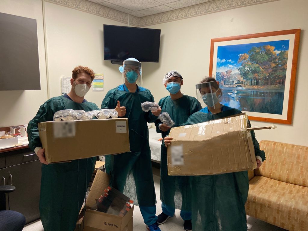 happy healthcare workers with gown delivery